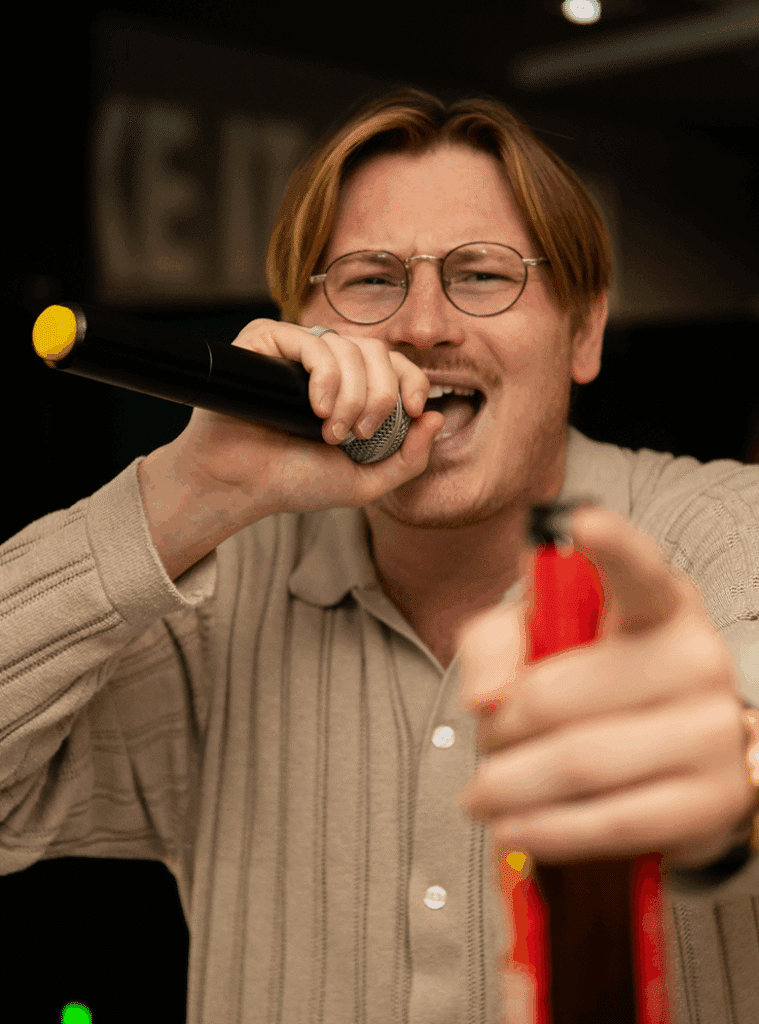 man singing karaoke