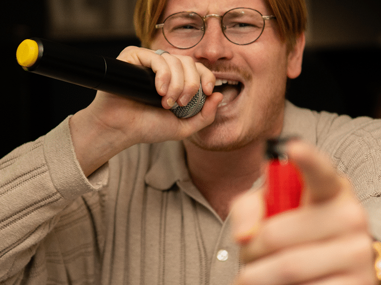 man singing karaoke