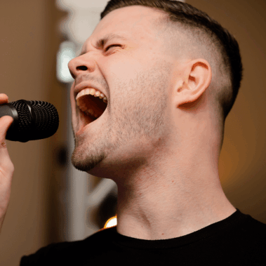 man singing karaoke