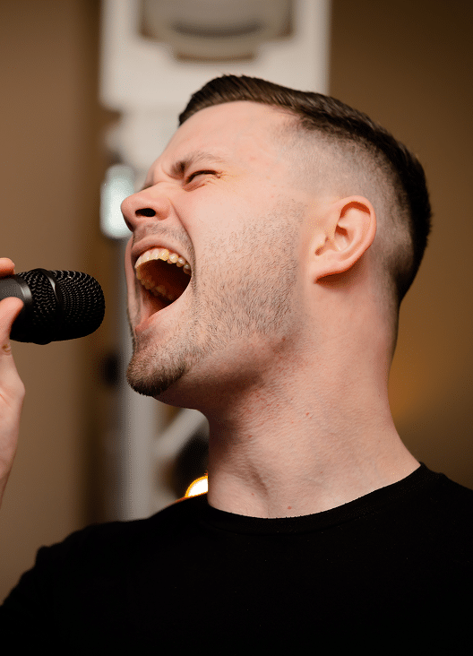 man singing karaoke